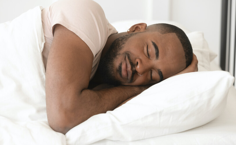 Man asleep in bed